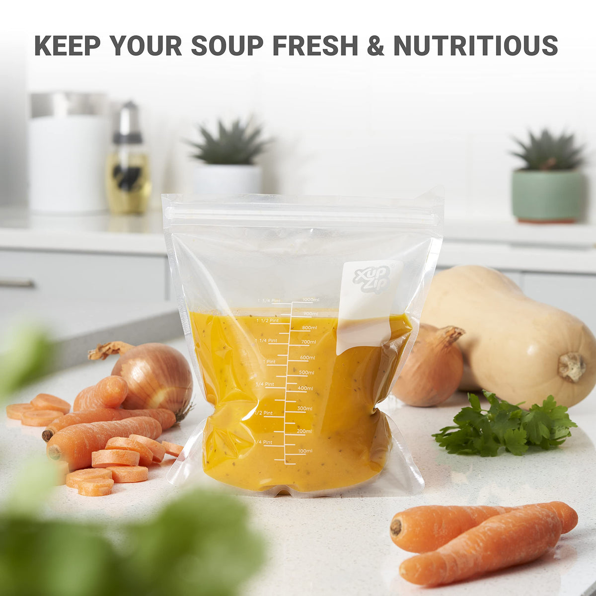 Clear upright XupZip stand and fill soup pouch filled with yellow soup on a white countertop beside fresh vegetables.