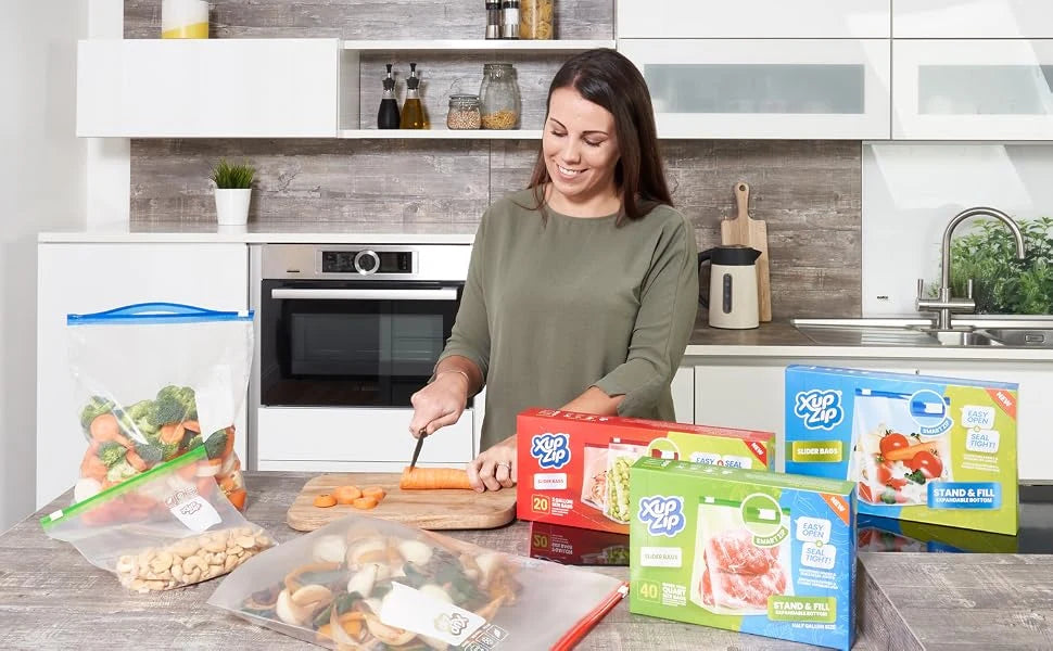 The XupZip food-storage range alongside a woman preparing vegetables in the kitchen